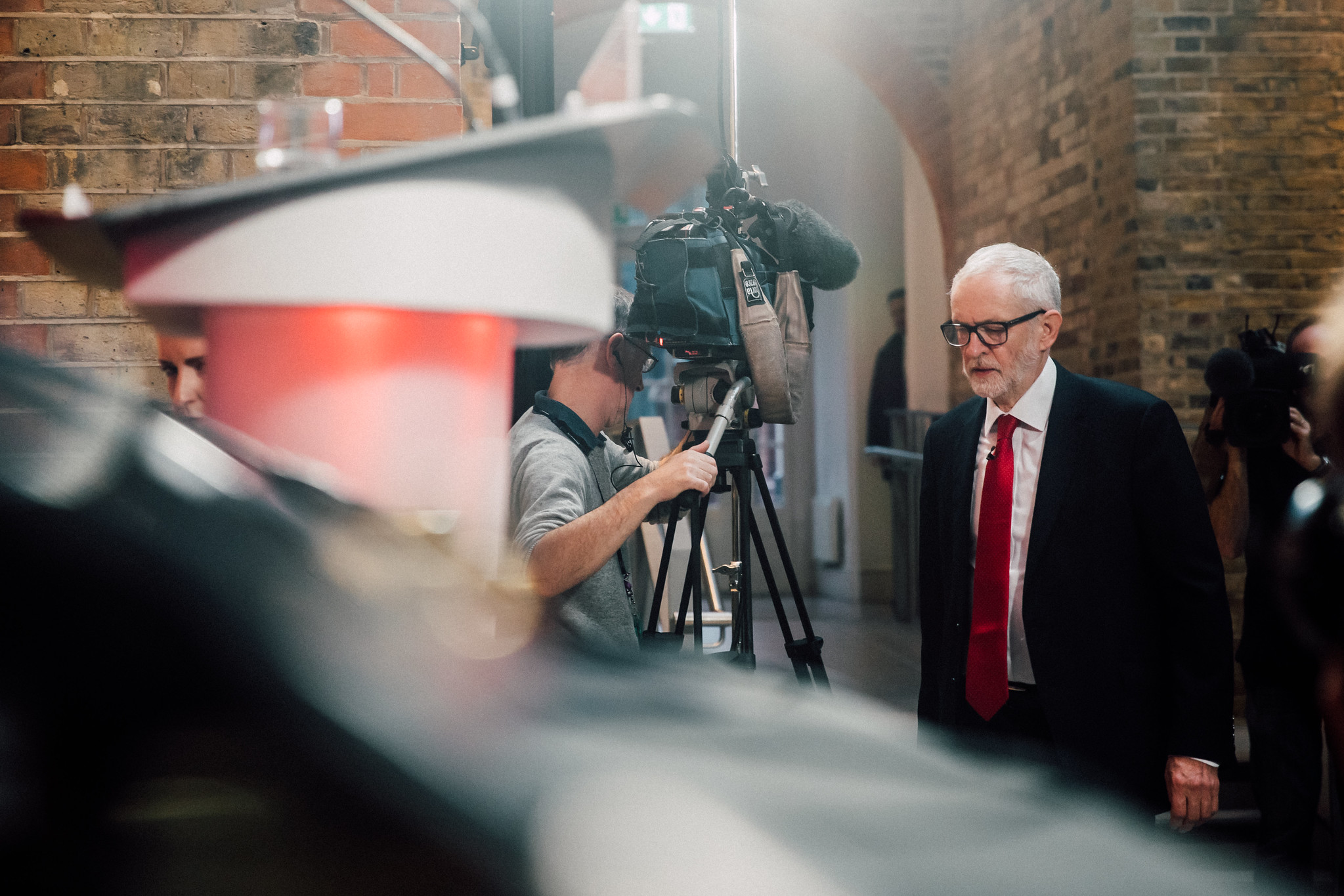 Jeremy Corbyn speaking to a television camera outside a rally