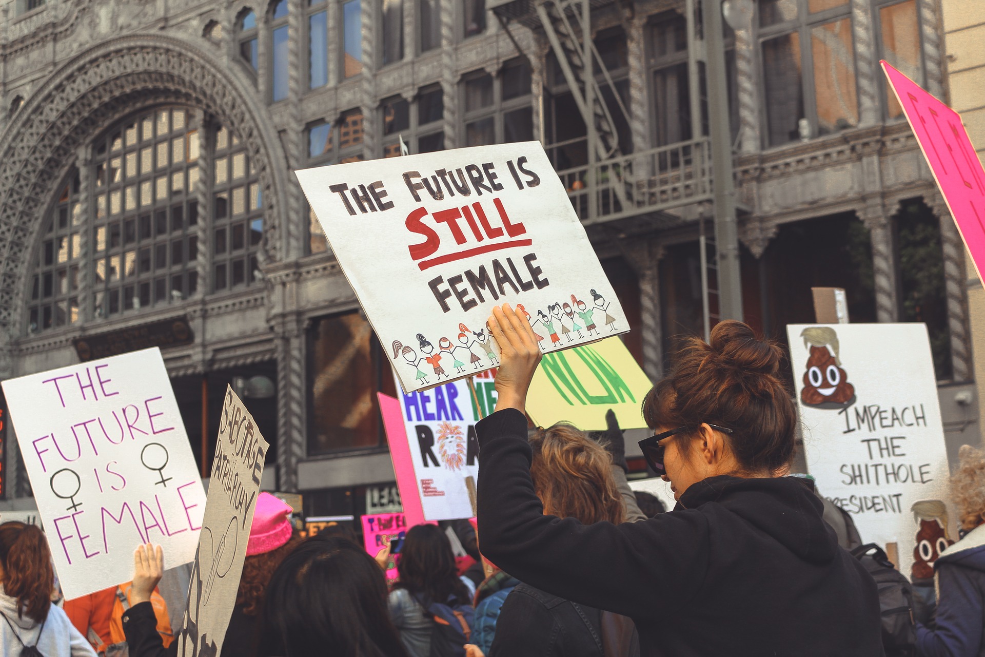 A march for feminism with women holding placards